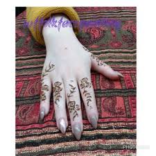 They were both helpful and managed the busy area well. Henna Tattoos