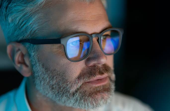 Blue light blocking lenses help filter blue-violet wavelengths during screen work, AI generated