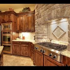Stone Work Above The Grill And Backsplash Knotty Alder Cabinets Alder Kitchen Cabinets Knotty Alder Kitchen Alder Cabinets