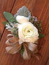Loved It Pinned It A Blooming Envy Design Corsage White Ranunculus Dusty Miller Seeded Eucalyptus Bru Prom Flowers White Ranunculus Real Wedding Flowers