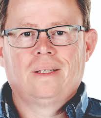 Kevin Habell, general manager at San Luis Rey Downs, stands among some of  the leftover debris from the Lilac Fire. (Howard Lipin UT)