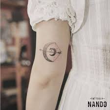 Usually done in blackwork, it shows the sagittarius sign in its basic form for a discreet yet meaningful appearance. Sagittarius Moon On The Back Of The Left Arm Sagittarius Tattoo Sagittarius Tattoo Designs Astrology Tattoo