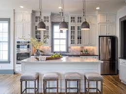 Maybe you would like to learn more about one of these? Four Backless Gray French Bar Stools Sit In Front Of A White Shiplap Island Topp Http Centophob White Kitchen Design Kitchen Design Kitchen Island Decor