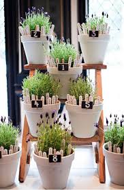 unique flower pot seating chart idea for a wedding reception