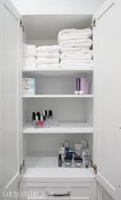Use your tape measure and divide the linen storage cabinet into three equal sections; Built In Linen Cabinet Sawdust Girl