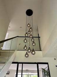 modern vide lamp with glass balls moderne vide lamp met zwart rookglazen bollen in 2021 staircase chandelier staircase chandelier modern staircase lighting ideas