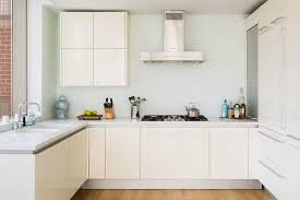 Read on to find ideas to frame your kitchen cabinets in a new light. White Flat Panel Kitchen Cabinets Design Ideas