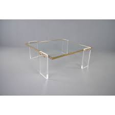 We love the curves on this unique coffee table. Vintage Coffee Table Brass Lucite Hollywood Regency 1980s Design Market