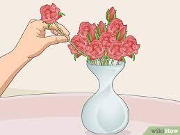 Use chicken wire to easily arrange flowers in a wide mouth vase or container. 3 Simple Ways To Arrange Flowers In A Vase Wikihow