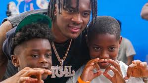 Nah'Shon Hyland, NBA player from Wilmington, holds basketball showcase