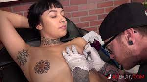 Skinny brunette has her perfect boobs tattooed then fucks the tattoo artist  - XNXX.COM