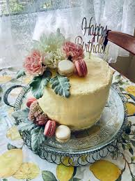 Have your cake baker or florist group a variety of flowers together that mirror your own bouquet, or have them whip up something totally different. Homemade Carrot Cake With Cream Cheese Frosting First Time Decorating With Fresh Flowers Foodporn