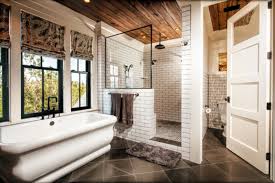 Create a visually interesting shower wall by using the vertically stacked subway tile pattern, but then offset the rows. Beautiful Bathrooms With Subway Tile