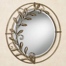 Add a few mirrors in your home to both add light and create the illusion of more space. Galeazzo Antique Gold Round Metal Wall Mirror