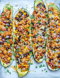 Taco Stuffed Zucchini Boats For Light And Satisfying Clean Eats Recipe Taco Stuffed Zucchini Zucchini Zucchini Boats