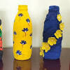 I found a flower vase /container that was taller and barely bigger than my bottles. 1