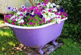 Using An Old Bathtub As A Container In Your Garden Garden Bathtub Garden Containers Container Garden Design