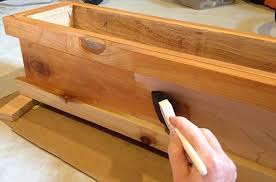 Adjustable bracket designed to fit over a 2 x 4 or 2 x 6 wood railing. How To Make A Deck Rail Planter Diy Project Guide Bob Vila