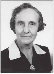 Mrs. Irma Eudy standing behind the candy counter in Eudy's Grocery Store  in1959. Their living quarters were in half of the building.