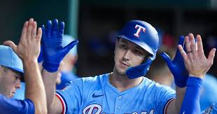 Rangers' Wyatt Langford exits with pesky side tightness, putting rest of  year in question