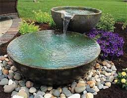 Water spout pond with bloosoms. 14 Awesome Small Pond Waterfall Ideas Outsidemodern Water Fountains Outdoor Patio Water Feature Fountains Backyard