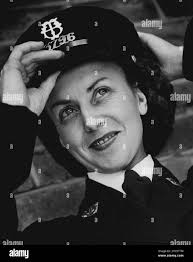 A little slip of a woman, with big, thoughtful grey eyes veteran Melbourne  bus conductress Mrs. Frank Reed (Irene Hancock). She has enjoyed her job  enough to stay in it for seven