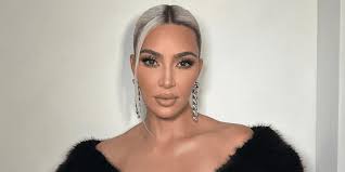 Kim Kardashian Channels Pamela Anderson With Blonde Bangs