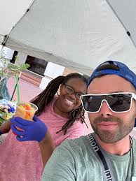 Chasen Cash Brown of Local Real Estate and Sweetees Treats & Design of  Local Landing set up at It's Pride Yall.