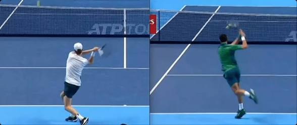 Two-handed backhand — arms reaching out to full contact, body driving forward