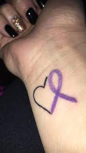 Find the perfect cancer tattoo designs stock illustrations from getty images. 25 Meaningful Ribbon Tattoo Designs For Beautiful Women Blurmark Cancer Ribbon Tattoos Crohns Tattoo Awareness Tattoo