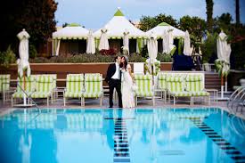 Swimming pool wedding decoration ideas. Portrait Of Happy Couple By Swimming Pool Photo By Southern California Wedding Photographers Callaway Gable Wedding Inspiration Board Junebug Weddings