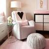 We opted for peachy pink walls in this room—plus a rug in a similar tone—which creates a warm, cozy glow. 3