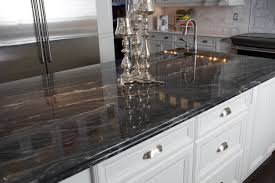 We love how the natural stone's colors beautiful work with the hammered copper sink and oak kitchen cabinets. Silver Granite Houzz