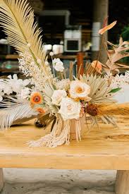 A sophisticated wedding bouquet with lunaria, dried herbs, blush and white blooms Dried Flower Boho Beach Centerpiece Ideas Dried Flowers Beach Centerpieces Floral Centerpieces