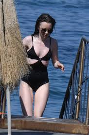 Each week, this page is updated with a gallery from a recent photo shoot. Lily Collins News On Twitter July 15th Lily Collins Wearing A Black One Piece Bathing Suit Ischia Porto
