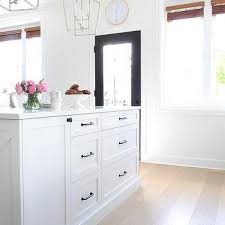 The bright white finish will surely lighten the kitchen space and add a modern touch to your home. Matte Black Pulls On White Shaker Cabinets Transitional Kitchen