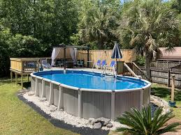 Above Ground Oval Pool And Deck With Privacy Fence Oval Pool Swimming Pools Backyard Above Ground Pool Landscaping