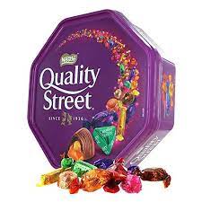 The page features a captivating photo of two young children alone in the street, clinging to each other with hearts for footprints. Buy Nestle Quality Street Tin Extra Large 900 Gram Can Limited Edition Online In Germany B07mcvvh91
