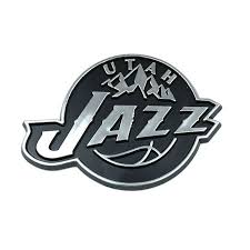 The utah jazz logo has navy, green, and yellow colors and the combination of a musical note and basketball objects replacing the letter j in jazz, with the name of the state on the upper right. Utah Jazz Black And Chrome Logo Utah Jazz Team Emblems Jazz