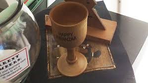 The History Principles And Symbols Of Kwanzaa Colour it in with authentic kwanzaa colours. history principles and symbols of kwanzaa