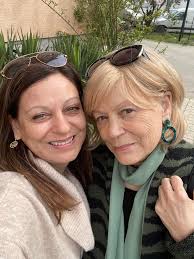 Can someone enhance the photo of my mom in Italy?