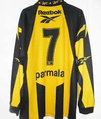 Black wth stripes to the left, is the curcc tribute. Penarol Home Football Shirt 1998 2000