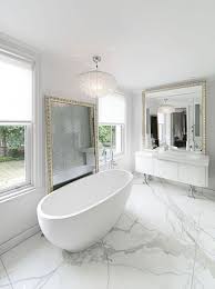 Long curtains elevate the space while a large gold towel rack makes a statement. 30 Modern Bathroom Design Ideas For Your Private Heaven Architecture Design Modern Bathroom Design White Bathroom Designs Marble Bathroom Designs