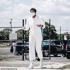 Check out our joel embiid selection for the very best in unique or custom, handmade pieces from our men's clothing shops. 76ers Joel Embiid Wears Hazmat Suit To Orlando Nba Bubble Daily Mail Online