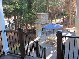 With current innovations, composite decking has gotten a lot easier to maintain. Second Story Trex Deck With Stone Patio Deckscapes
