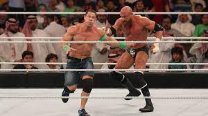 Young people, girls and boys, are engaged in wrestling on the seashore. Wwe Abc Was Bedeuten Wrestling Begriffe Wie Finisher Stable Turn