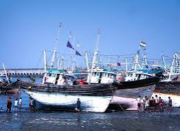 Fishing boats at low tide in Mumbai