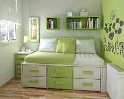 In this instance, the compact room has also been kept light through the use of pale. Green Bedroom Space Saver Girls Bedroom Colors Small Room Bedroom Simple Bedroom Design