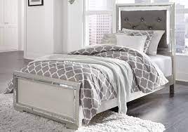Storage beds feature a spacious hidden drawer that pulls out from the foot of each frame—perfect for keeping linens and blankets organized and out of sight. Lonnix Silver Twin Upholstered Bed Cincinnati Overstock Warehouse