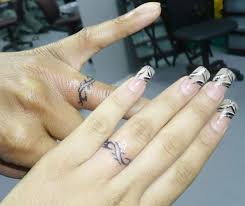 Finding the design you want for your wedding ring tattoo isn't the hard part—it's finding the reputable, experienced, licensed tattoo artist to ink your wedding ring tattoo. Pin By Natalie Miller On Wedding Ring Tat Ideas Ring Tattoo Designs Ring Finger Tattoos Marriage Ring Tattoos